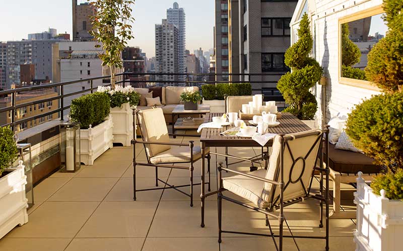 rooftop patio with formal boxwood topiaries