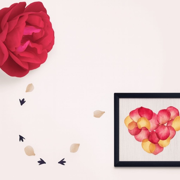 Pressed flower petal heart next to a pink flower with text that says, "Pressed Petal Art from the Heart."